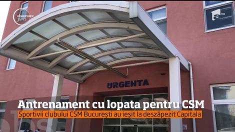 Antrenament cu lopata pentru sportivii de la CSM Bucureşti