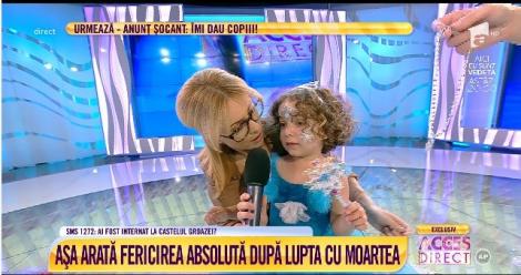 Așa arată fericirea absolută! Simona Gherghe prezintă emisiunea cu o fetiță în brațe