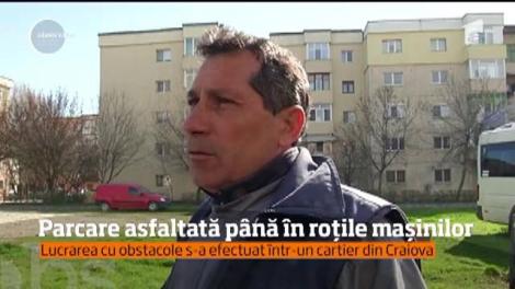 Doreii lovesc din nou! Au turnat asfalt într-o parcare din Craiova, dar numai în jurul maşinilor