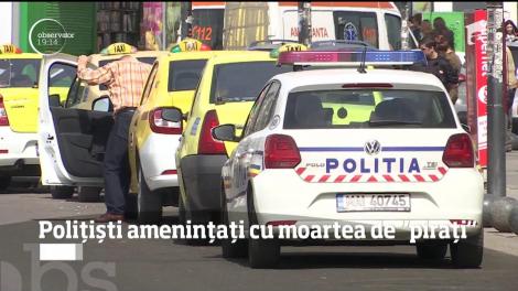 Poliţişti ameninţaţi cu moartea de taximetrişti piraţi