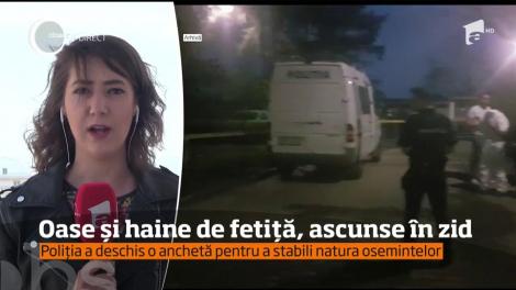 Mai multe oase, dar şi bucăţi din haine de fetiţă au fost găsite într-un zid, de un bărbat care s-a mutat în casă nouă, în judeţul Gorj