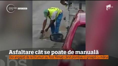 "Hai, băieții, hai!" Așa se asfaltează la noi: Doi angajați de la Drumuri, filmați când plombau o groapă cu mâna