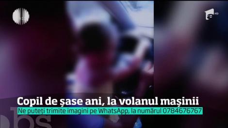 Scenă revoltătoare, în trafic! Copil de șase ani, surprins la volanul mașinii, în timp ce conduce, încurajată de părinți. Fetița a fost la un pas de tragedie