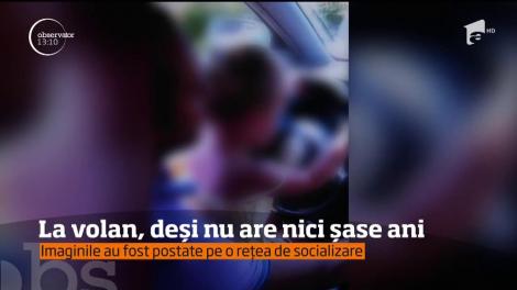 O fetiţă de nici şase ani, filmată la volanul unui autoturism în mişcare