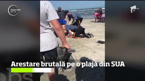 Imagini BRUTALE! O femeie este BĂTUTĂ CU BESTIALITATE de polițiști pe plajă! Filmulețul a stârnit valuri de indignare!