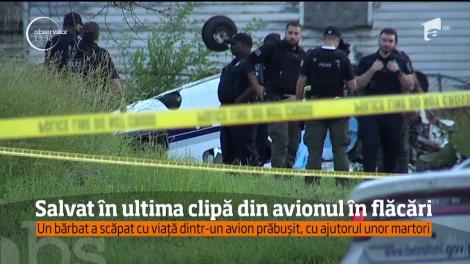 Intervenţia promptă a unor martori a salvat viaţa unui pilot al cărui avion s-a prăbuşit şi a luat foc