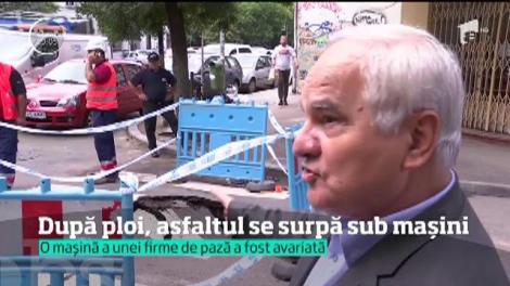 După ploi, asfaltul se surpă sub mașni. S-a întâmplat în București