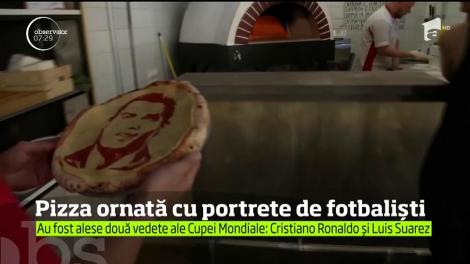 Un maestru bucătar din Sankt Petersburg le oferă clienţilor pizza ornată cu portretele unor vedete ale competiţiei: Cristiano Ronaldo şi Luis Suarez