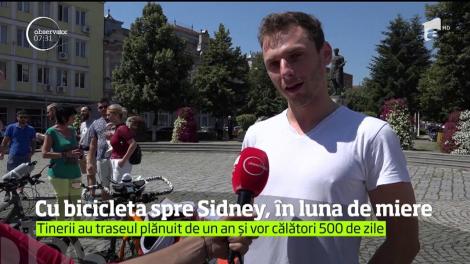 Cu bicicleta. spre Sidney! Aşa au ales doi tineri proaspăt căsătoriţi să-şi petreacă luna de miere