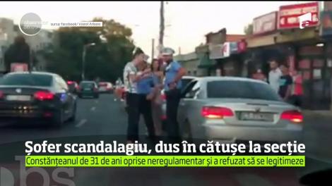 Șofer scandalagiu, dus în cătușe la secția de poliţie