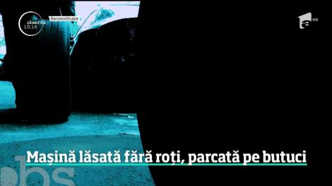 O maşină a rămas fără roţi, în parcarea unui bloc din Bucureşti