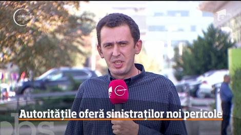 Oamenii rămaşi pe drumuri după ce blocul din cartierul Rahova a ars au fost mutaţi de autorităţi într-un imobil fără aviz ISU