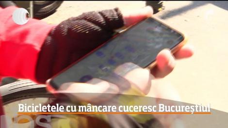 Bicicletele cu mâncare cuceresc Bucureștiul. Mulți tineri își rotunjesc veniturile