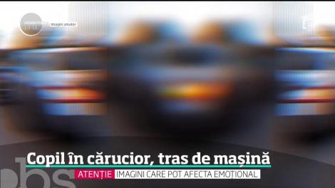 Imagini incredibile pe o şosea din Gorj! O mamă şi-a filmat bebeluşul într-un cărucior tractat de o maşină