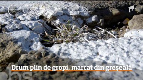 Drum plin de gropi, marcat din greseală cu vopsea