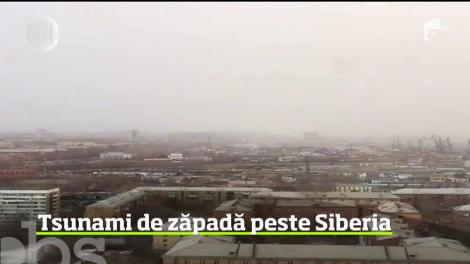 Imagini dramatice au fost surprinse în Siberia. Un tsunami de zăpadă a acoperit un oraş în câteva minute