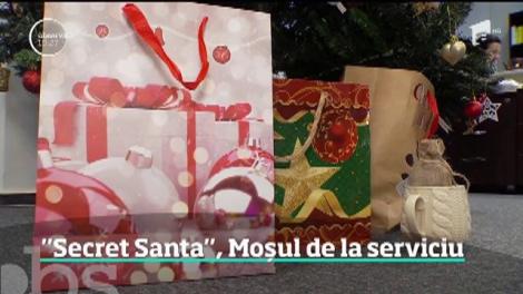 Moş Crăciun vine în secret la serviciu! Un joc numit Secret Santa îi provoacă pe angajaţi să facă schimb de cadouri-surpriză