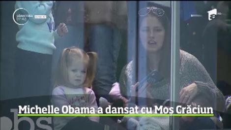 Michelle Obama a dansat cu Moș Crăciun