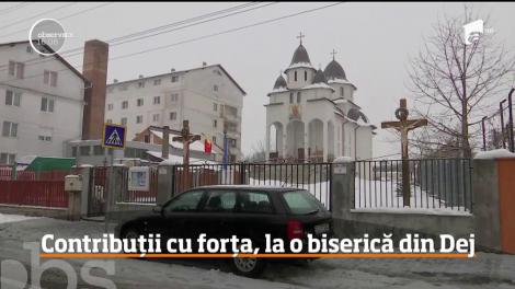 Locuitorii unui cartier din Dej au primit acasă o înştinţare din partea preotului prin care li se aducea la cunoştinţă că au datorii la biserică!