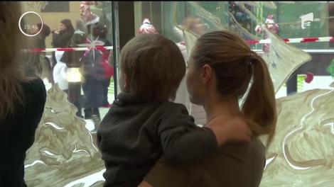 Moş Crăciun a schimbat tactica în Rusia. S-a căţărat pe zidurile unui spital din Moscova şi le-a adus copiilor bolnavi cadourile dorite