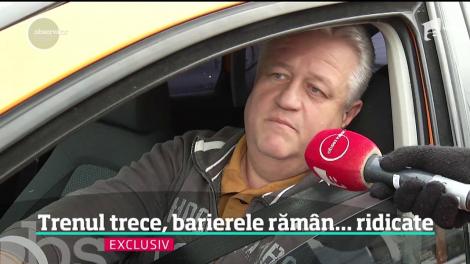 Pericol de moarte pe calea ferată! Pe o şosea cu sute de maşini din nordul Capitalei barierele au rămas blocate sus în timp ce trenul trecea