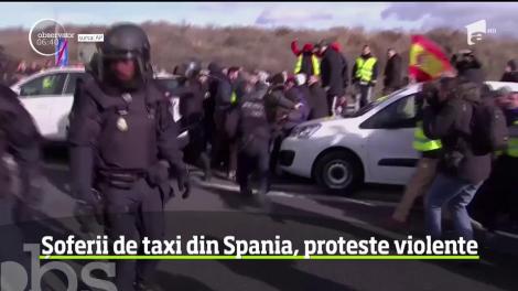 În Spania, un protest al taximetriştilor a degenerat în confruntări cu forţele de ordine