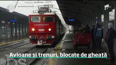 Avioane și trenuri, blocate de ploaia înghețată