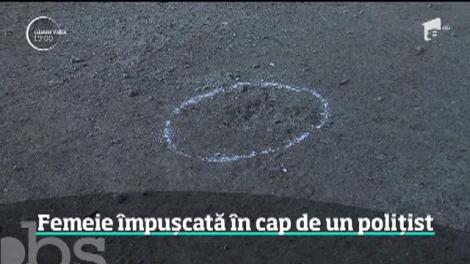 Într-o urmărire cu focuri de armă, un poliţist a împuşcat în cap o femeie care nu avea nicio vină