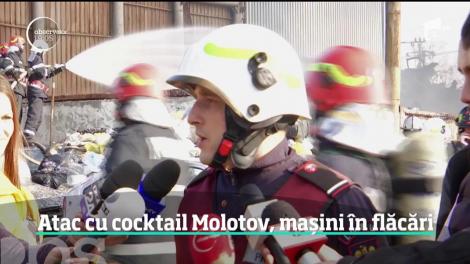 Atac cu cocktail Molotov, mașini în flăcări