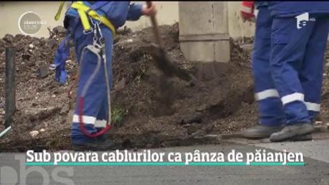 Orașele care au scăpat de cablurile de pe stâlpi. În Bucureşti doar 10 la sută dintre fire au fost îngropate