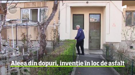 Un craiovean i-a lăsat cu gura căscată pe vecini. Ca să scape de noroiul din faţa blocului, omul a pavat aleea cu dopuri de sticlă, în loc de asfalt