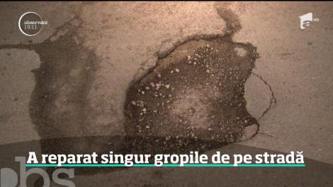 Un bucureştean şi-a reparat singur drumul din faţa locuinţei sale!