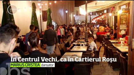 Moda dansatoarelor în vitrină s-a mutat din Amsterdam la Bucureşti. Ce se întâmplă după miezul nopţii în Centrul Vechi