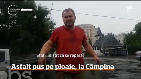 Muncitorii din Câmpina care repară gropile ce s-au format pe străzile principale, nu ţin cont de vreme