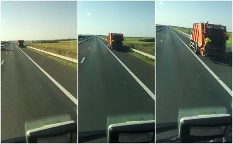 Video. O mașină de gunoi „zboară” pe autostradă cu doi angajați atârnați pe scara din spate!