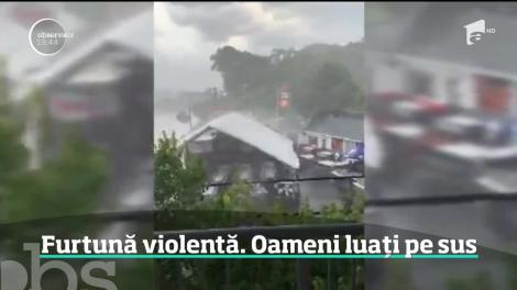 Doi oameni au scăpat ca prin minune după ce vântul i-a ridicat zeci de metri în aer,  în Carolina de Sud