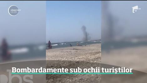 Pe litoral, ca la război! Aşa s-au simţit mai mulţi turişti aflaţi pe plaja de la Vadu. Au privit înspăimântaţi mai multe explozii puternice