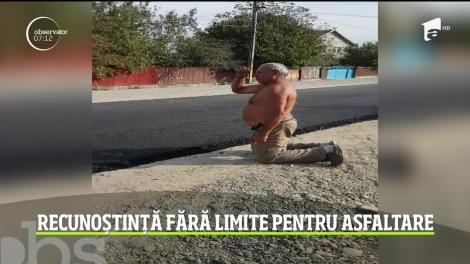 Un bărbat dintr-o localitate din judeţul Bacău a sărutat asfaltul abia pus pe drumul comunal de fericire că va scăpa de praf