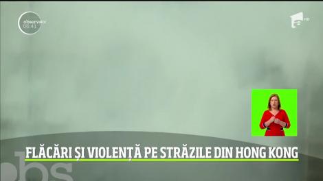 Flăcări și violență pe străzile din Hong Kong