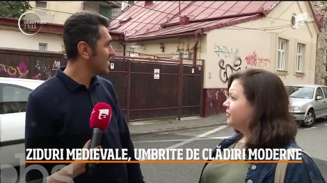 Ziduri medievale, umbrite de clădiri moderne