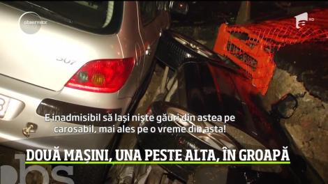 Imagini halucinante în cartierul Drumul Taberei din Capitală. Doi şoferi au căzut cu maşinile, unul peste celălalt, într-o groapă uriaşă