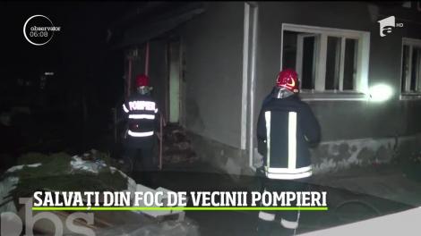 Doi pompieri aflaţi în timpul liber şi-au salvat vecinii din casa cuprinsă de flăcări