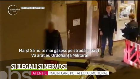 Un agent de poliţie din București trânteşte la pământ şi loveşte cu picioarele un tânăr prins la băut, în stradă, în plină restricţie