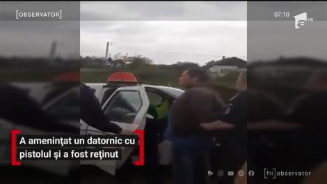 A amenințat un datornic cu pistolul și a fost reținut