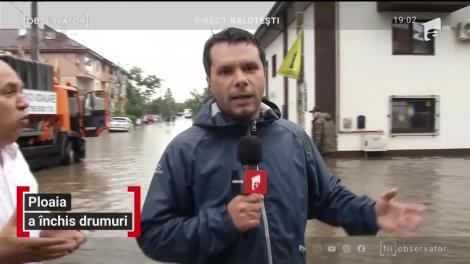 Ploaia a inundat drumul principal din Baloteşti