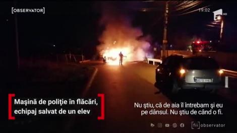 Doi poliţişti şi un jandarm, captivi într-o maşină de poliţie în flăcări, au fost salvaţi de un elev