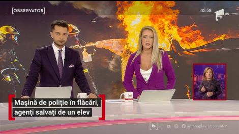 Mașină de poliție în flăcări, agenți salvați de un elev, în Câmpulung Muscel