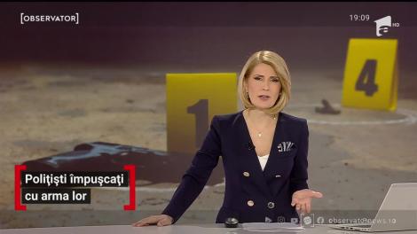 Polițiști împușcați cu arma lor