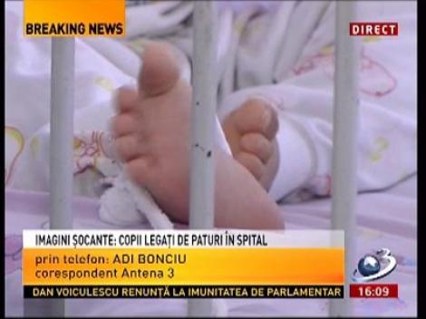 IMAGINI ŞOCANTE! Copii legaţi de paturi în unele saloane din spitalul din Buzău