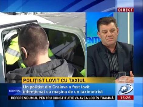 Poliţist, lovit cu maşina de un taximetrist furios